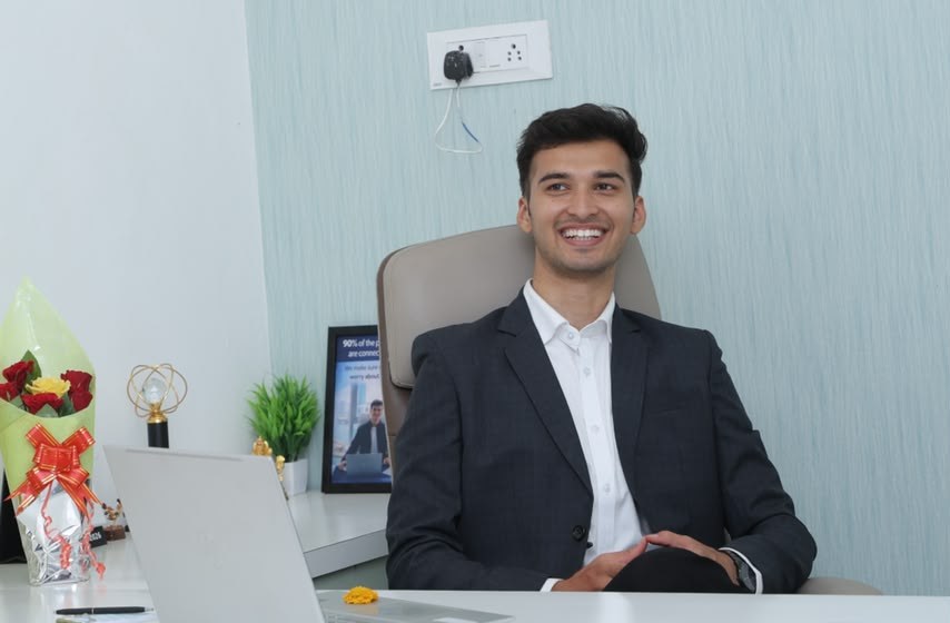 Darshan Borse at his desk in Deopur, Dhule